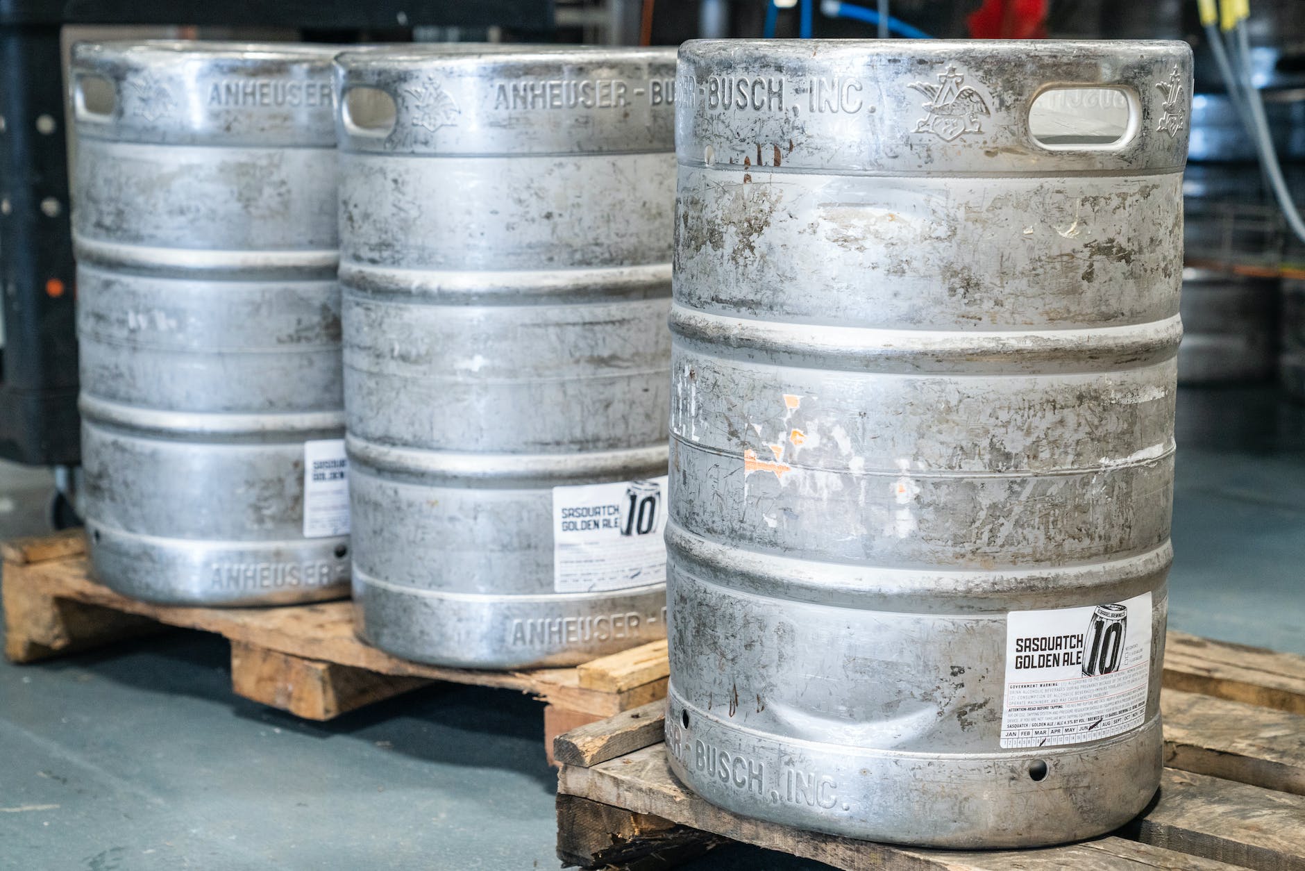 pexels-photo-1267334 three beer kegs on pallets