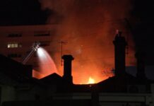 Firefighters battle Brunswick shop fire