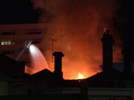 Firefighters battle Brunswick shop fire