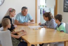 Take action this winter for family fire safety table gathering family