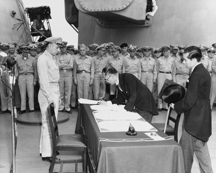 Mamoru_Shigemitsu_signs_the_Instrument_of_Surrender,_officially_ending_the_Second_World_War