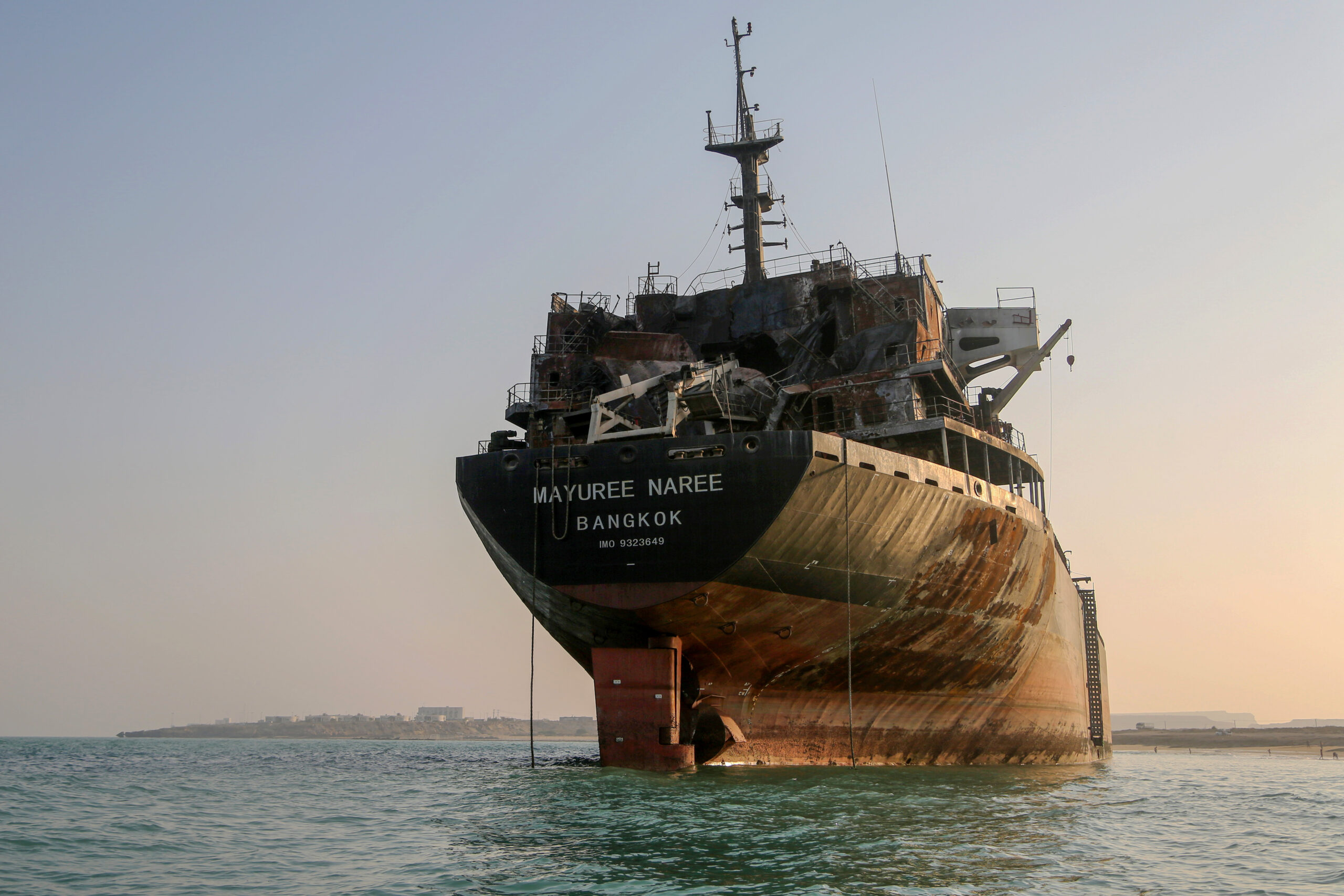 Thailand-flagged vessel struck near Strait of Hormuz awaits removal off Iran's Qeshm Island